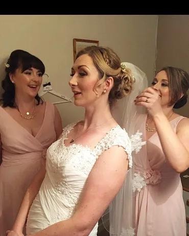 Bride with bridesmaids getting ready